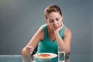Image of lady eating a bad diet
